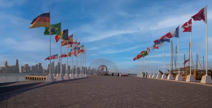 The FIFA World Cup Qatar 2022 Official Countdown Clock at Doha?s picturesque Corniche Fishing Spot with flags of participating countries
