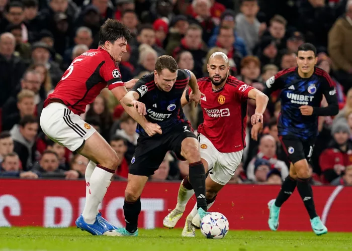 Manchester, UK. 24th Oct, 2023. Harry Maguire (l) and Sofyan Amrabat of Manchester United (r) tackle Viktor Claesson of FC Copenhagen during the UEFA Champions League match at Old Trafford, Manchester. Picture credit should read: Andrew Yates/Sportimage C